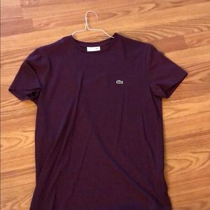This is a medium size Lacoste shirt.